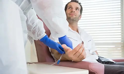man-with-nurse-getting-peptide-treatment